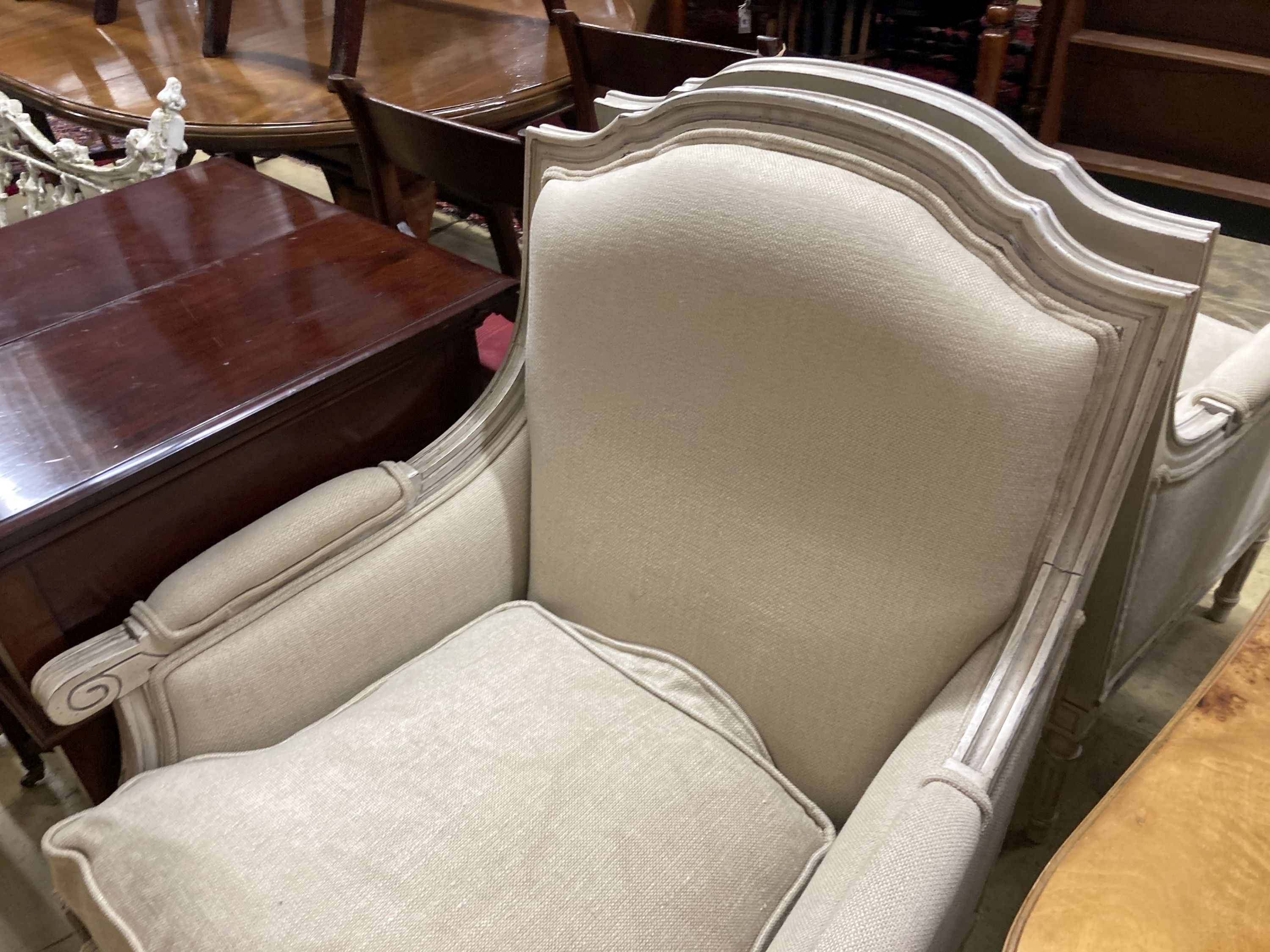 A pair of painted French style upholstered armchairs, width 70cm, depth 70cm, height 96cm